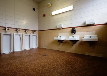 Yellow Walls Gray Urinals Before